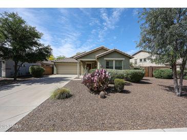 Charming single-story home with desert landscaping and a two-car garage at 12845 W Milton Dr, Peoria, AZ 85383