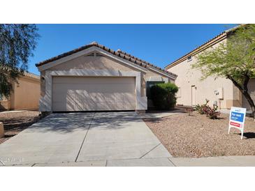 Single Gathering home with a two car garage, desert landscaping, and a for rent sign at 23424 W Pima St, Buckeye, AZ 85326