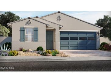 Charming single-story home featuring a two-car garage, desert landscaping, and stylish exterior paint at 5537 S 246Th Ave, Buckeye, AZ 85326