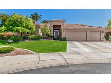 Charming single-story home featuring a three-car garage, mature landscaping, and inviting curb appeal at 9571 N 117Th St, Scottsdale, AZ 85259