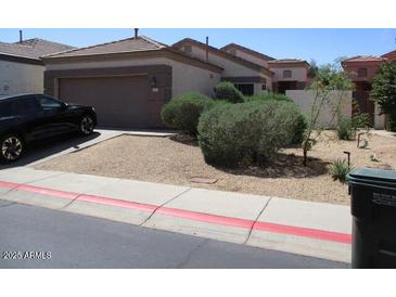 Charming single-level home with a two-car garage and desert landscaping at 3237 E Fremont Rd, Phoenix, AZ 85042