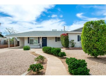 Charming single-story home featuring a landscaped front yard and welcoming walkway at 508 S Ernie Pl, Tempe, AZ 85281