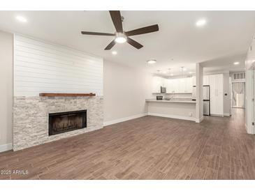 Spacious living room with modern finishes and open floor plan at 7700 E Gainey Ranch Rd # 102, Scottsdale, AZ 85258