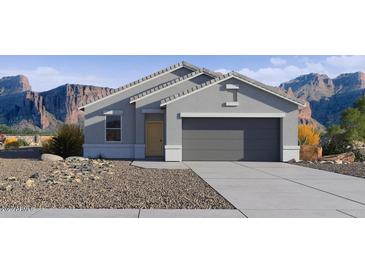 Charming single-story home with a neutral color palette, complemented by a low-maintenance desert landscape at 5530 E Mearn Rd, San Tan Valley, AZ 85140