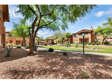 View of desert landscaping and beautiful grounds surrounding the community at 11500 E Cochise Dr # 1015, Scottsdale, AZ 85259