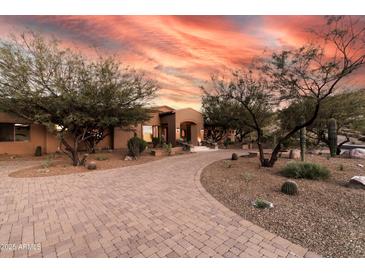 Expansive property featuring mature desert landscaping and a circular paved driveway at 14760 E Paradise Dr, Fountain Hills, AZ 85268