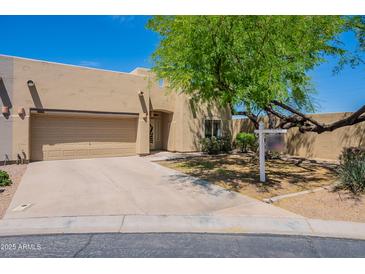 Charming single-Gathering home with desert landscaping, a two-car garage, and a cozy front entrance at 440 S Val Vista Dr # 11, Mesa, AZ 85204