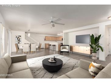 Open-concept living area showcases a modern design with tile floors, neutral decor, and lots of space at 999 S Sabino Dr, Gilbert, AZ 85296