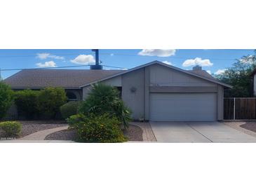 Charming single-story home with desert landscaping, a two-car garage, and neutral color palette at 10201 S 49Th St, Phoenix, AZ 85044