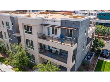 Modern townhome with multi-level balconies, showcasing contemporary design and outdoor living spaces at 1250 N Abbey Ln # 275, Chandler, AZ 85226