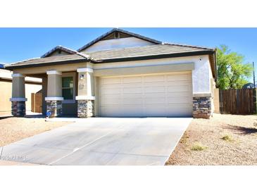 Charming single-story home with a two-car garage and low maintenance desert landscaping at 2745 W Jessica Ln, Phoenix, AZ 85041