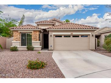 Charming single-story home with a well-maintained front yard and a neutral color palette at 4152 S Bandit Ct, Gilbert, AZ 85297