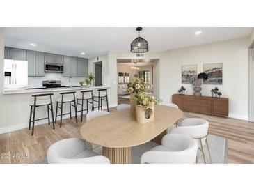Inviting dining room adjacent to a modern kitchen, perfect for entertaining and Gathering meals at 5221 N 24Th St # 103, Phoenix, AZ 85016