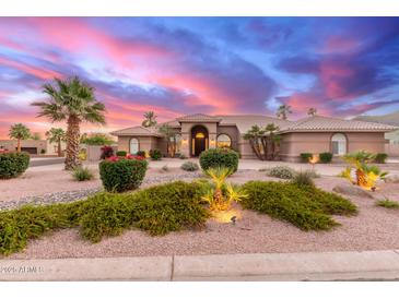 Expansive ranch home with desert landscaping and dramatic sunset skies at 3733 E Kachina Dr, Phoenix, AZ 85044