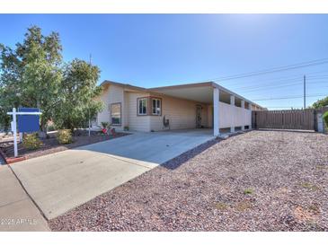 Charming single-story home with covered parking and low-maintenance desert landscaping at 1855 N Rim Rock Dr, Casa Grande, AZ 85122