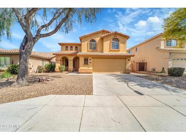Charming two-story home featuring a well-maintained yard and inviting curb appeal at 2306 W Spur Dr, Phoenix, AZ 85085