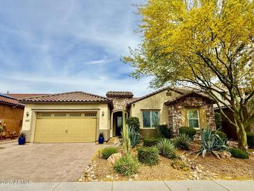 Charming single-Gathering home with desert landscaping and a two-car garage, showcasing curb appeal at 31107 N 27Th Ave, Phoenix, AZ 85085