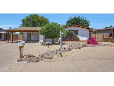 Charming single-story home featuring a well-kept desert landscaped front yard and inviting curb appeal at 4808 W Shaw Butte Dr, Glendale, AZ 85304