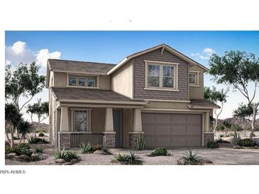 Charming two-story home with a covered front porch and an attached two-car garage at 5529 W Mauna Loa Ln, Glendale, AZ 85306