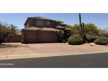 Charming two-story home with a well-manicured front yard and desert landscaping at 6939 E Upper Trail Cir # 16, Mesa, AZ 85207