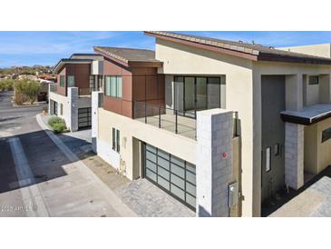 Beautiful two-story home with a balcony, large garage, and modern architectural design at 1 Easy St # 4, Carefree, AZ 85377