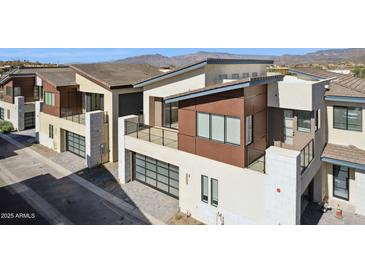 Modern two-story home with a sleek design, garage and balcony, showcasing contemporary architectural details at 1 Easy St # 5, Carefree, AZ 85377