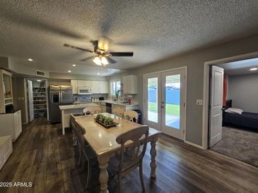 Bright living space that flows into a modern kitchen and dining area at 1904 E Jarvis Ave, Mesa, AZ 85204
