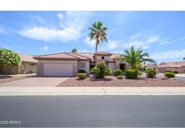 Charming single-story home featuring desert landscaping and a tile roof at 20039 N Hearthstone Dr, Surprise, AZ 85374