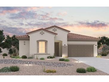 Inviting single-story home displaying a tile roof and neutral stucco exterior, complemented by a two-car garage and desert landscaping at 8470 S 168Th Ave, Goodyear, AZ 85338