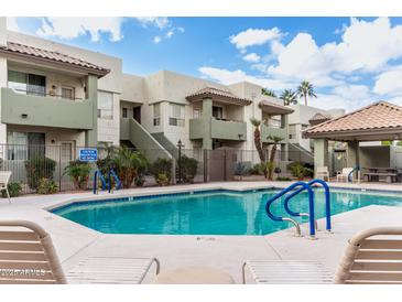 A refreshing community pool with lounge chairs offers a perfect spot for relaxation and leisure at 1825 W Ray Rd # 2132, Chandler, AZ 85224