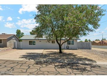 Charming single-story home featuring a mature tree, driveway and landscaping in a desirable neighborhood at 2395 S Arizona Rd, Apache Junction, AZ 85119