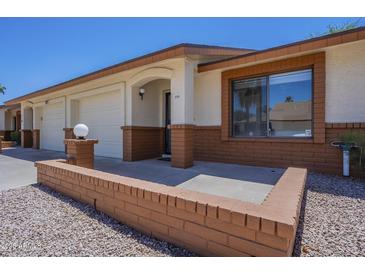 Charming single-story home with a well-manicured front yard and a one-car garage at 8261 E Keats Ave # 396, Mesa, AZ 85209
