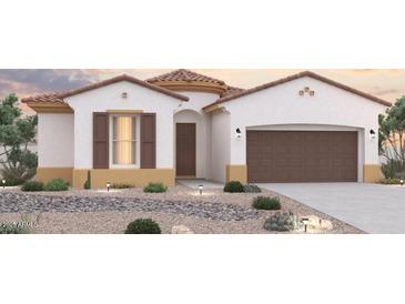 Charming single-story home featuring a two-car garage and low-maintenance desert landscaping at 8488 S 168Th Ave, Goodyear, AZ 85338
