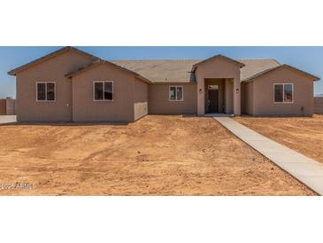 Tan single story house with tile roof and covered front porch, new construction at 9485 W Sandstone Mountain Dr, Casa Grande, AZ 85194