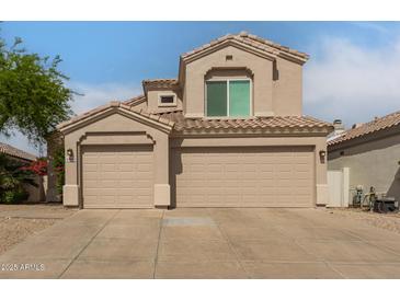 Charming home featuring a three-car garage and a beautifully tiled roof at 13993 N 102Nd St, Scottsdale, AZ 85260