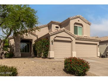 Charming home featuring a three-car garage and mature landscaping at 13993 N 102Nd St, Scottsdale, AZ 85260