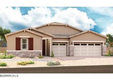 Charming single-story home featuring a three-car garage and beautiful stone accents at 20286 W Monterey Way, Buckeye, AZ 85396