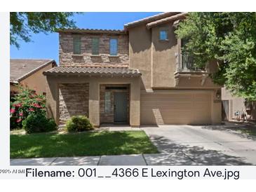 Charming two-story home with a well-manicured lawn and a neutral color scheme at 4366 E Lexington Ave, Gilbert, AZ 85234