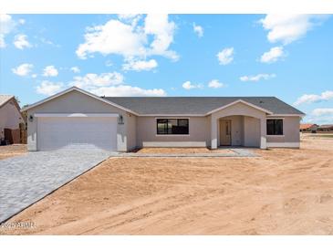 Charming single-story home featuring a gray facade, attached garage, and desert landscaping at 9280 W Wenden Dr, Arizona City, AZ 85123