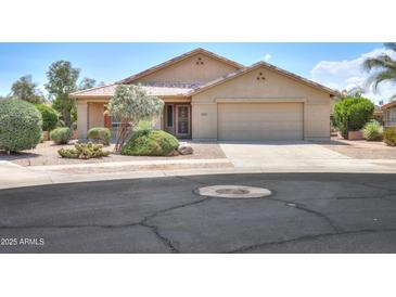 Charming single-story home featuring a well-maintained yard and a two-car garage at 135 S Verde Ln, Casa Grande, AZ 85194