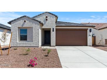 Charming home featuring a low-maintenance landscape and a two-car garage at 23404 W Burton Ave, Buckeye, AZ 85326