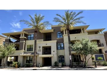Attractive condominium building with palm trees, balconies, and a well-maintained facade at 7601 E Indian Bend Rd # 1049, Scottsdale, AZ 85250