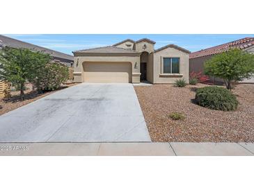 Charming single-story home with a two-car garage and low-maintenance desert landscaping at 31006 W Weldon Ave, Buckeye, AZ 85396
