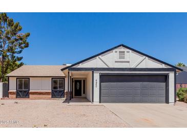 Charming single-story home showcasing a well-maintained facade, desert landscaping and an attached two car garage at 4640 W Gail Dr, Chandler, AZ 85226
