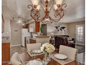 Inviting dining room with chandelier, connected to the kitchen and living area; perfect for gatherings at 5995 N 78Th St # 1047, Scottsdale, AZ 85250