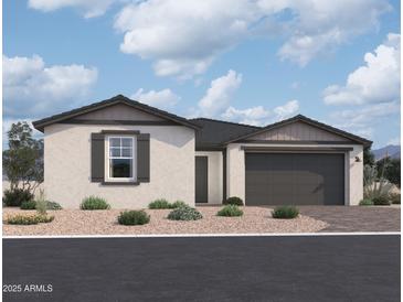 Charming single-story home with a two-car garage, desert landscaping, and neutral stucco facade at 26370 N 77Th Dr, Peoria, AZ 85383