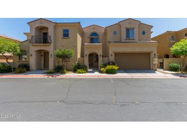 Charming townhome with a private entry gate and a spacious two-car garage at 1367 S Country Club Dr # 1299, Mesa, AZ 85210
