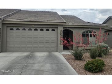Charming single-story home with desert landscaping and a neutral color palette for a welcoming curb appeal at 3117 S Signal Butte Rd # 492, Mesa, AZ 85212