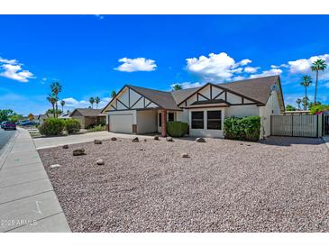 Charming single-story home with gravel landscaping, mature trees, and inviting curb appeal at 6160 E Inglewood St, Mesa, AZ 85205