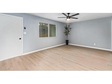 Bright living room with a ceiling fan, nice flooring and plenty of natural light at 6565 N 19Th Ave # 45, Phoenix, AZ 85015